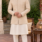 Men's luxury cream prince coat with intricate golden embroidery, elegant mandarin collar, and premium traditional design, perfect for Pakistani weddings, grooms, and formal events.